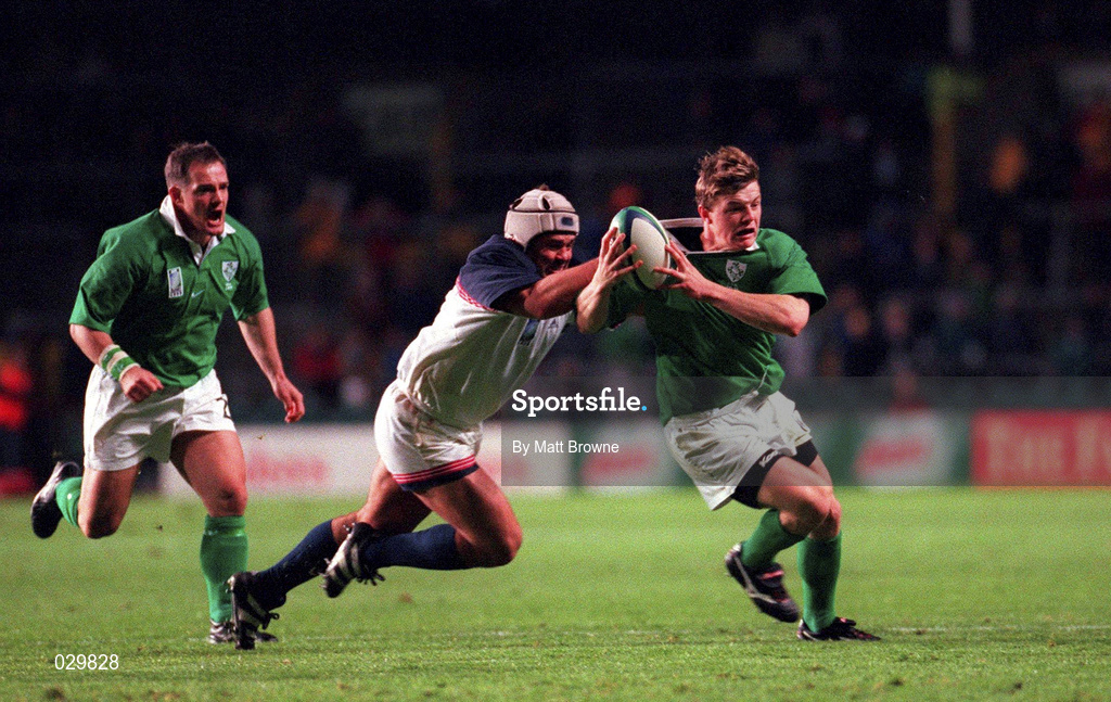 2 October 1999; Ireland's Brian O'Driscoll is tackled by George Sucher of USA during the Rugby World Cup Pool E match between Ireland and USA at Lansdowne Road in Dublin. Photo by Matt Browne/Sportsfile