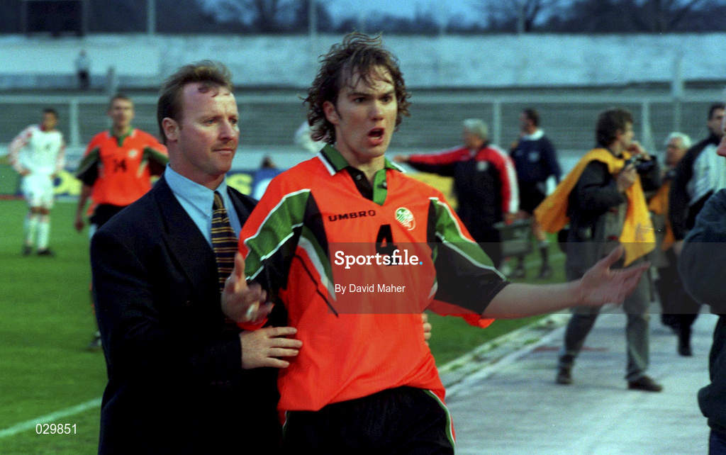 2 April 1997; Jason McAteer of Republic of Ireland with Tony Hickey, team security, after being sent off during the FIFA World Cup Qualifying Group 8 match between FYR Macedonia and Republic of Ireland at City Stadium in Skopje, FYR Macedonia. Photo by David Maher/Sportsfile