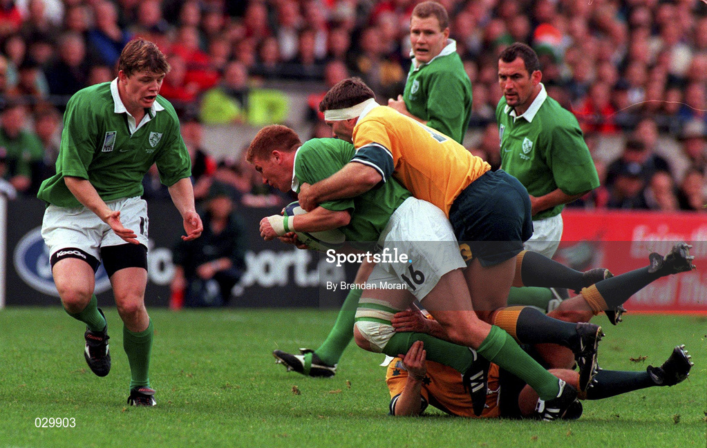 10 October 1999; Jonathan Bell of Ireland is tackled by Tim Horan, grounded, and Tiann Strauss of Australia during the Rugby World Cup Pool E match between Ireland and Australia at Lansdowne Road in Dublin. Photo by Brendan Moran/Sportsfile