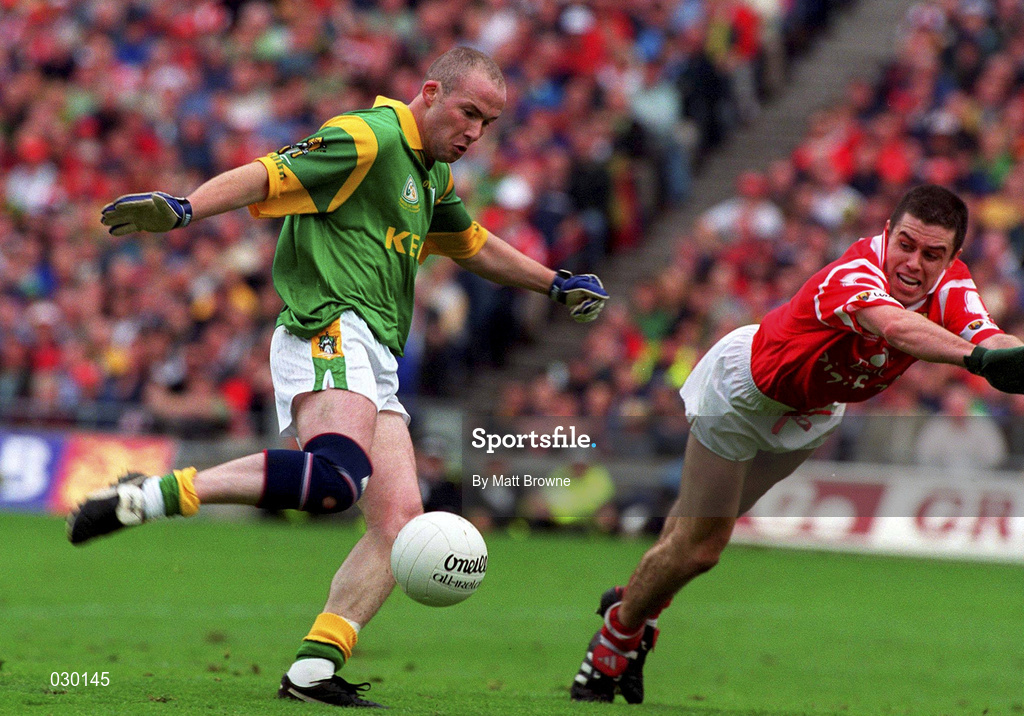 26 September 1999; Ollie Murphy of Meath scores his side's goal despite the efforts of Martin Cronin of Cork during the Bank of Ireland All-Ireland Senior Football Championship Final between Meath and Cork at Croke Park in Dublin. Photo by Matt Browne/Sportsfile