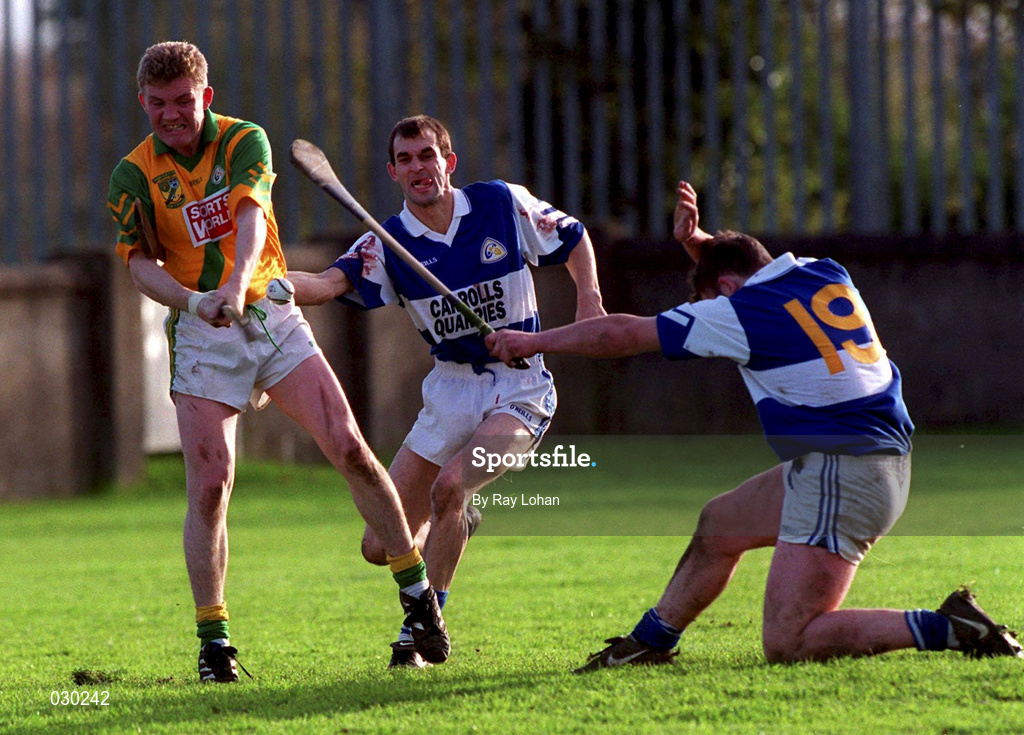 30 October 1999; Ger Cuddy, 19, of Castletown blocks down the attempt of Faughs' Ruari Boland during the AIB Leinster Club Hurling Championship Quarter-Final match between Castletown, Laois, and Faughs, Dublin, at Parnell Park in Dublin. Photo by Ray Lohan/Sportsfile