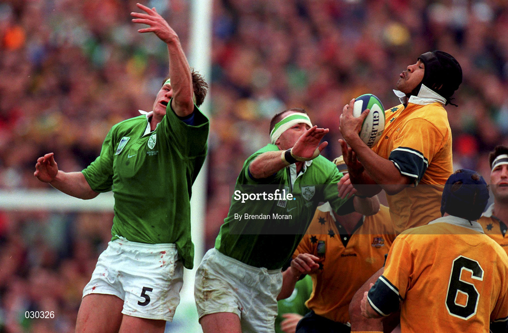 10 October 1999; Toutai Kefu of Australia gathers the ball from ahead of Trevor Brennan and Malcolm O'Kelly, left, of Ireland during the Rugby World Cup Pool E match between Ireland and Australia at Lansdowne Road in Dublin. Photo by Brendan Moran/Sportsfile