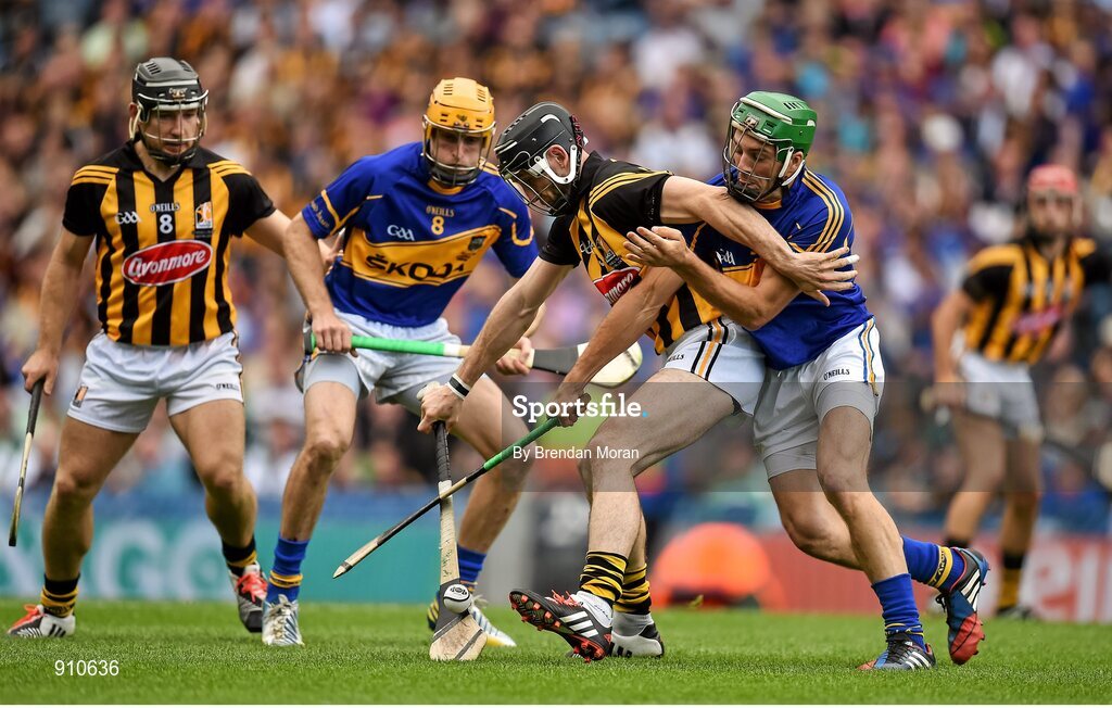 7 September 2014; Conor Fogarty, Kilkenny, holds off the challenge of James Woodlock, Tipperary, as Richie Hogan, left, Kilkenny, and Shane McGrath, Tipperary, look on. GAA Hurling All Ireland Senior Championship Final, Kilkenny v Tipperary. Croke Park, Dublin. Picture credit: Brendan Moran / SPORTSFILE