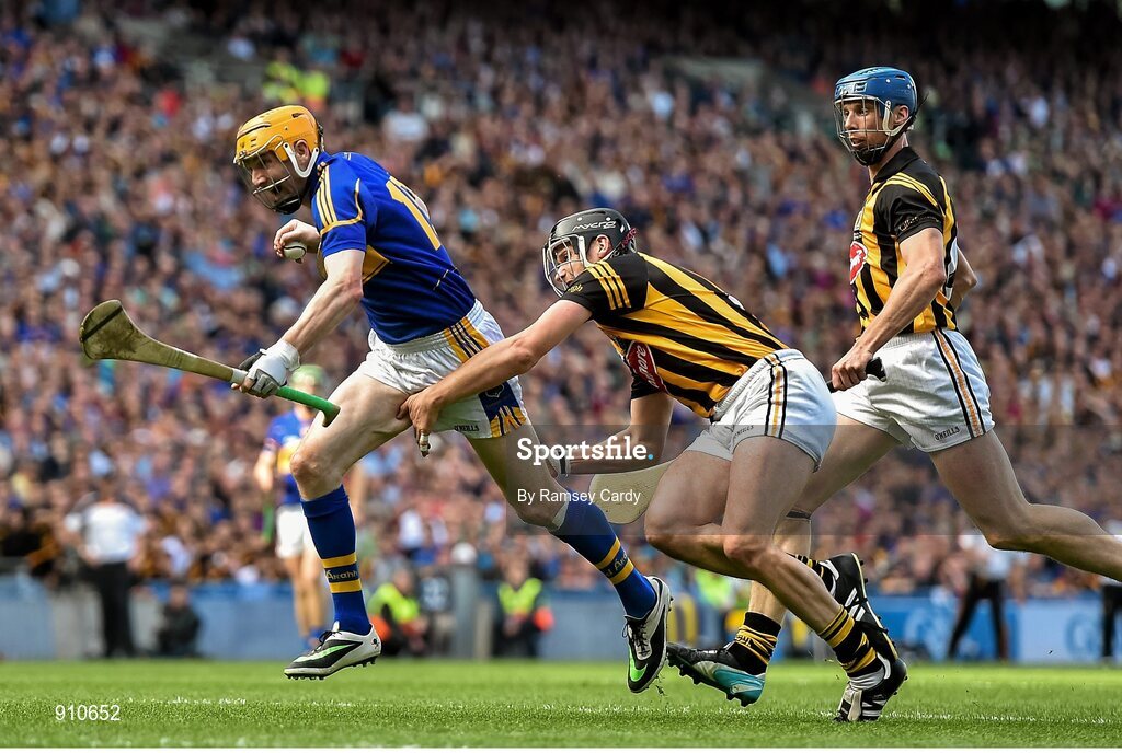 7 September 2014; Tipperary's Lar Corbett is tripped by Kilkenny's Jackie Tyrrell, which resulted in a penalty for Kilkenny. GAA Hurling All Ireland Senior Championship Final, Kilkenny v Tipperary. Croke Park, Dublin. Picture credit: Ramsey Cardy / SPORTSFILE