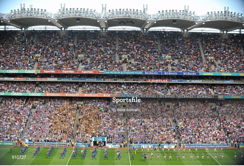 7 September 2014; The Kilkenny and Tipperary teams parade behind the Artane School of Music Band in front of the Cusack Stand. GAA Hurling All Ireland Senior Championship Final, Kilkenny v Tipperary. Croke Park, Dublin. Picture credit: Dáire Brennan / SPORTSFILE
