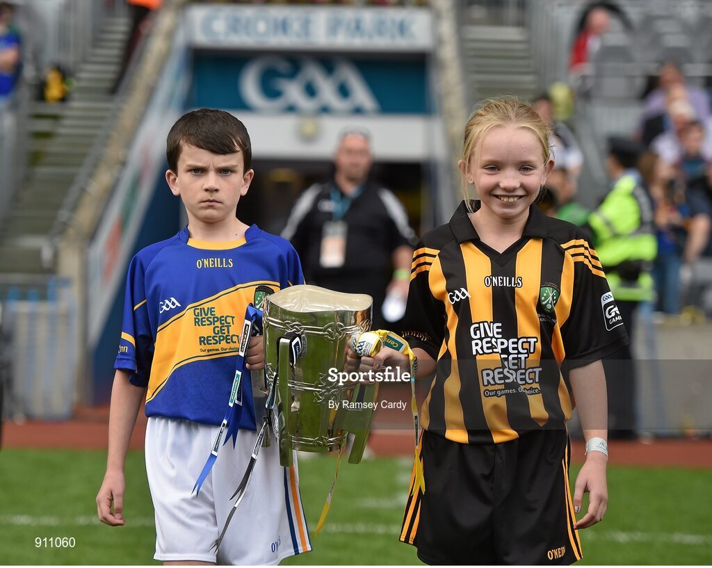 7 September 2014; Diarmuid O'Carroll, Donaskeigh NS, Co. Tipperary and Aoife Mulhall, St. Joseph's NS, Clinstown, Co. Kilkenny, carry out the Liam MacCarthy Cup before the game. GAA Hurling All Ireland Senior Championship Final, Kilkenny v Tipperary. Croke Park, Dublin. Picture credit: Ramsey Cardy / SPORTSFILE