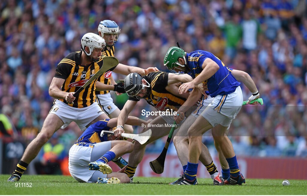 7 September 2014; Kilkenny players, from left, Michael Fennelly, TJ Reid, and Richie Hogan contest for possession with Tipperary players Shane McGrath and James Woodlock, right. GAA Hurling All Ireland Senior Championship Final, Kilkenny v Tipperary. Croke Park, Dublin. Picture credit: Brendan Moran / SPORTSFILE