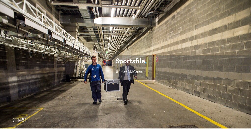 7 September 2014; Croke Park stadium announcer Jerry Grogan, right, and Croke Park steward Adam Burke, carry the Liam MacCarthy cup into the stadium before the game. GAA Hurling All Ireland Senior Championship Final, Kilkenny v Tipperary. Croke Park, Dublin. Picture credit: Ray McManus / SPORTSFILE