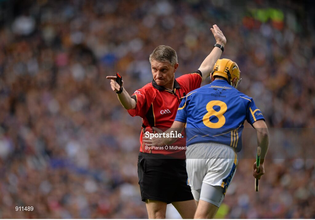 7 September 2014; Shane McGrath, Tipperary, runs past referee Barry Kelly after his side were awarded a free. GAA Hurling All Ireland Senior Championship Final, Kilkenny v Tipperary. Croke Park, Dublin. Picture credit: Piaras Ó Mídheach / SPORTSFILE