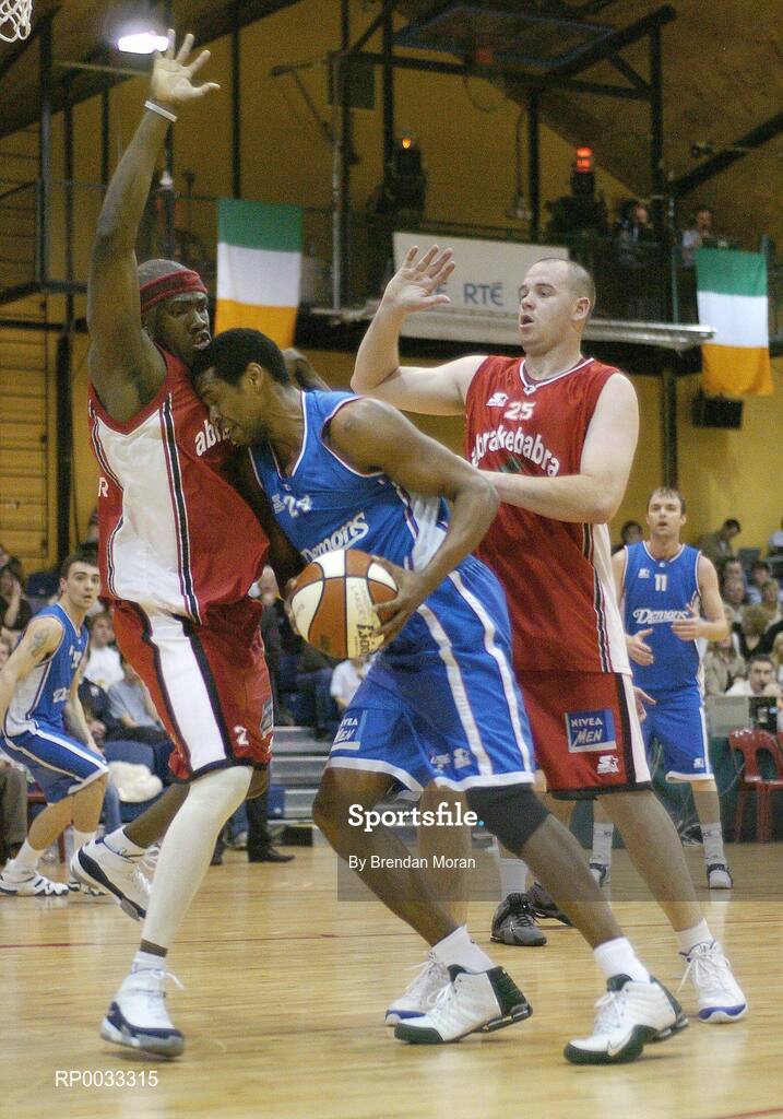 28 January 2007; Benito Flores, UCC Demons, in action against Wilder Auguste, left, and Michael Quirke, Abrakebabra Tigers. Men's Superleague National Cup Final, Abrakebabra Tigers, Tralee, Co. Kerry v UCC Demons, Cork, National Basketball Arena, Tallaght, Dublin. Picture credit: Brendan Moran / SPORTSFILE