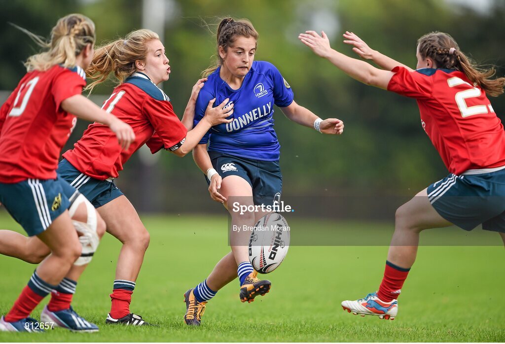 13 September 2014; Meg Parkinson, Leinster, kicks through Munster players, from left, Laura O'Mahony, Ashline Hutchings and Amy O'Callaghan. Women’s Senior Interprovincial, Leinster v Munster, Ashbourne RFC, Ashbourne, Co. Meath. Picture credit: Brendan Moran / SPORTSFILE