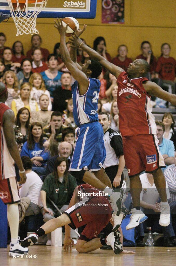 28 January 2007; Benito Flores, UCC Demons, is checked by Roscoe Patterson, Abrakebabra Tigers. Men's Superleague National Cup Final, Abrakebabra Tigers, Tralee, Co. Kerry v UCC Demons, Cork, National Basketball Arena, Tallaght, Dublin. Picture credit: Brendan Moran / SPORTSFILE