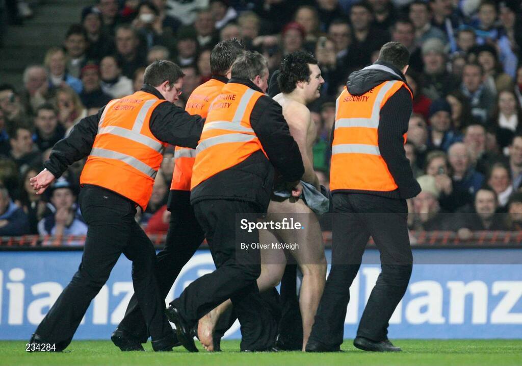 3 February 2007; A streaker is lead off the pitch. Allianz NFL Division 1A, Dublin v Tyrone, Croke Park, Dublin. Picture credit: Oliver McVeigh / SPORTSFILE