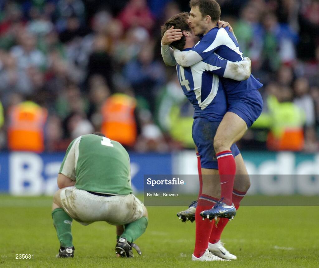 11 February 2007; Lionel Nallet, 4, and Pierre Mignoni, France, celebrate as a dejected Marcus Horan drops to his knees. RBS Six Nations Rugby Championship, Ireland v France, Croke Park, Dublin. Picture Credit: Matt Browne / SPORTSFILE