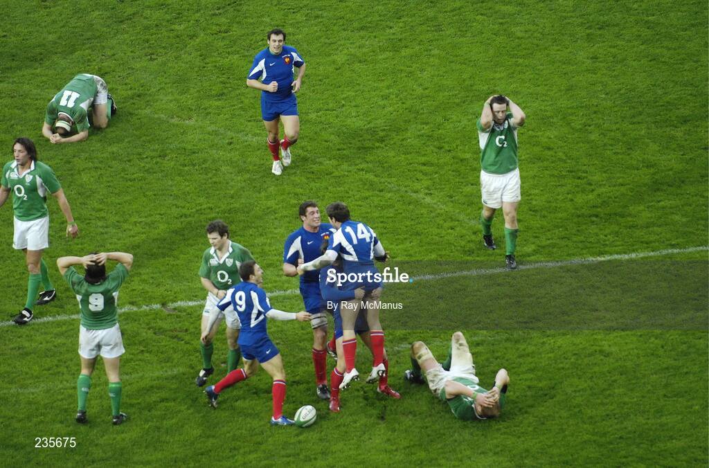 11 February 2007; France's Vincent Clerc, 14, is congratulated on scoring his side's last minute game winning try as Irish players look dejected. RBS Six Nations Rugby Championship, Ireland v France, Croke Park, Dublin. Picture credit: Ray McManus / SPORTSFILE