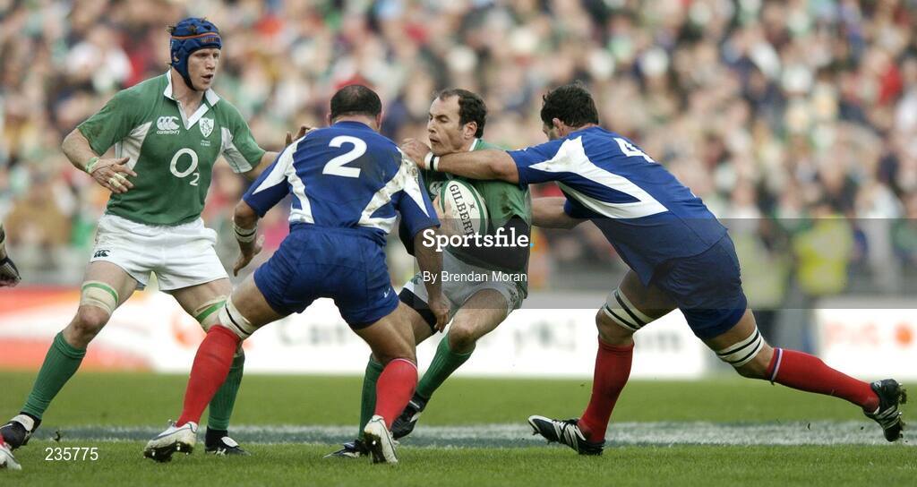 11 February 2007; Girvan Dempsey, Ireland, is tackled by Raphael Ibanez, 2, and Lionel Nallet, France. RBS Six Nations Rugby Championship, Ireland v France, Croke Park, Dublin. Picture Credit: Brendan Moran / SPORTSFILE