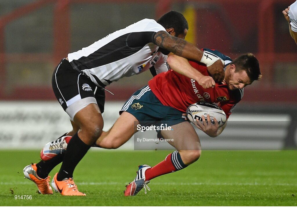 19 September 2014; Jonathan Holland, Munster, is tackled by Samuela Vunisa, Zebre. Guinness PRO12, Round 3, Munster v Zebre. Thomond Park, Limerick. Picture credit: Diarmuid Greene / SPORTSFILE