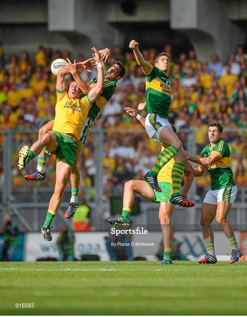 21 September 2014; Donegal's Neil Gallagher, with support from Michael Murphy, hidden, in action against Kerry players, from left, Anthony Maher, David Moran and Aidan O'Mahony. GAA Football All Ireland Senior Championship Final, Kerry v Donegal. Croke Park, Dublin. Picture credit: Piaras Ó Mídheach / SPORTSFILE