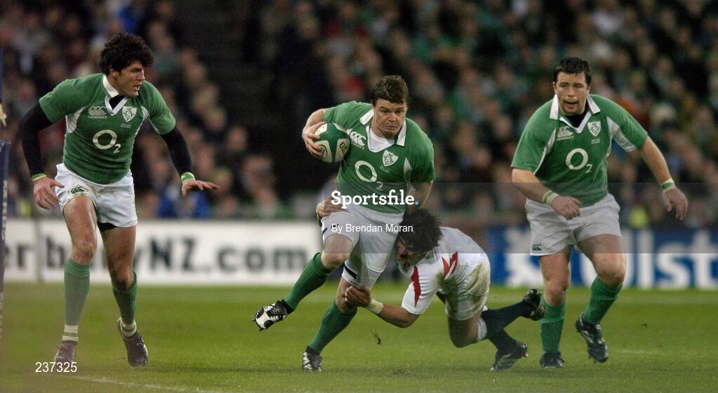 24 February 2007; Brian O'Driscoll, Ireland, supported by team-mates Shane Horgan, left, and Marcus Horan, is tackled by Harry Ellis, England. RBS Six Nations Rugby Championship, Ireland v England, Croke Park, Dublin. Picture Credit: Brendan Moran / SPORTSFILE