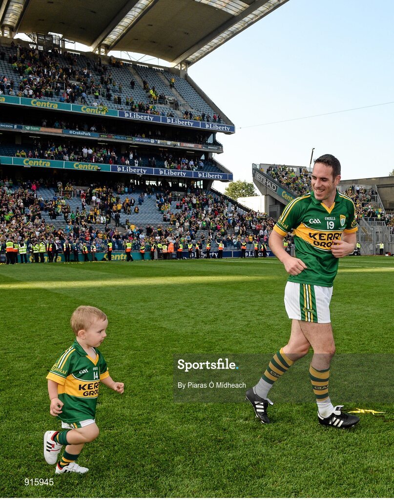 21 September 2014; Kerry's Declan O'Sullivan celebrates with his son Ollie, aged 2, after the game. GAA Football All Ireland Senior Championship Final, Kerry v Donegal. Croke Park, Dublin. Picture credit: Piaras Ó Mídheach / SPORTSFILE