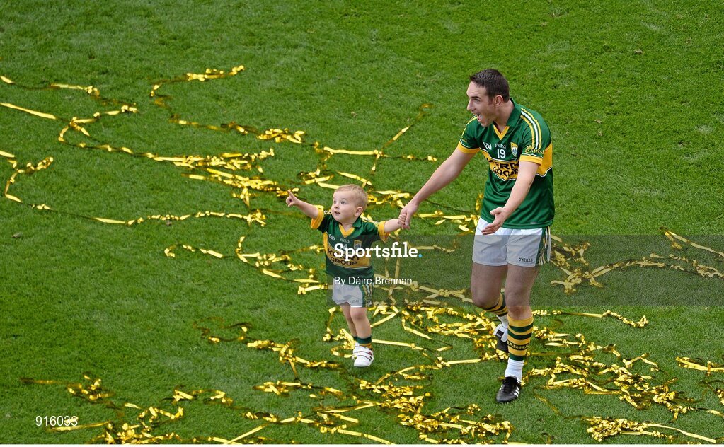 21 September 2014; Declan O'Sullivan, Kerry, and his son Ollie, aged 2, celebrate after the game. GAA Football All Ireland Senior Championship Final, Kerry v Donegal. Croke Park, Dublin. Picture credit: Dáire Brennan / SPORTSFILE