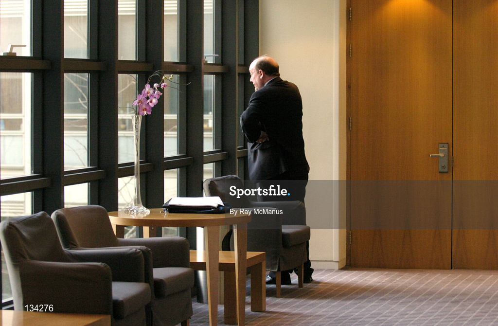 13 March 2004; John Byrne, the defeated candidate for the position of General Manager of the eircom League of Ireland, makes a telephone call after the result of the ballott was announced during the Eircom League AGM at the Clarion Hotel in the International Financial Services Centre, Dublin. Photo by Ray McManus/Sportsfile