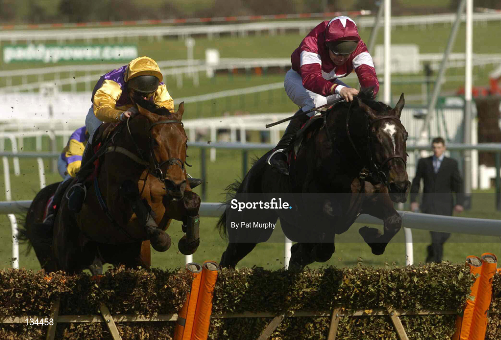 16 March 2004; Brave Inca, with Barry Cash up, left, jumps the last on their way to winning The Lethbey & Christopher Supreme Novices' Hurdle from eventual second place finisher War of Attrition, with Conor O'Dwyer up, during Day One of the Cheltenham Racing Festival at Prestbury Park in Cheltenham, England. Photo by Pat Murphy/Sportsfile