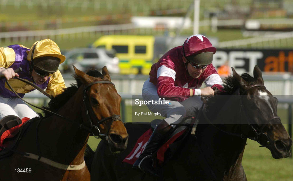 16 March 2004; Brave Inca, with Barry Cash up, left, on their way to winning The Lethbey & Christopher Supreme Novices' Hurdle from eventual second place finisher War of Attrition, with Conor O'Dwyer up, during Day One of the Cheltenham Racing Festival at Prestbury Park in Cheltenham, England. Photo by Pat Murphy/Sportsfile