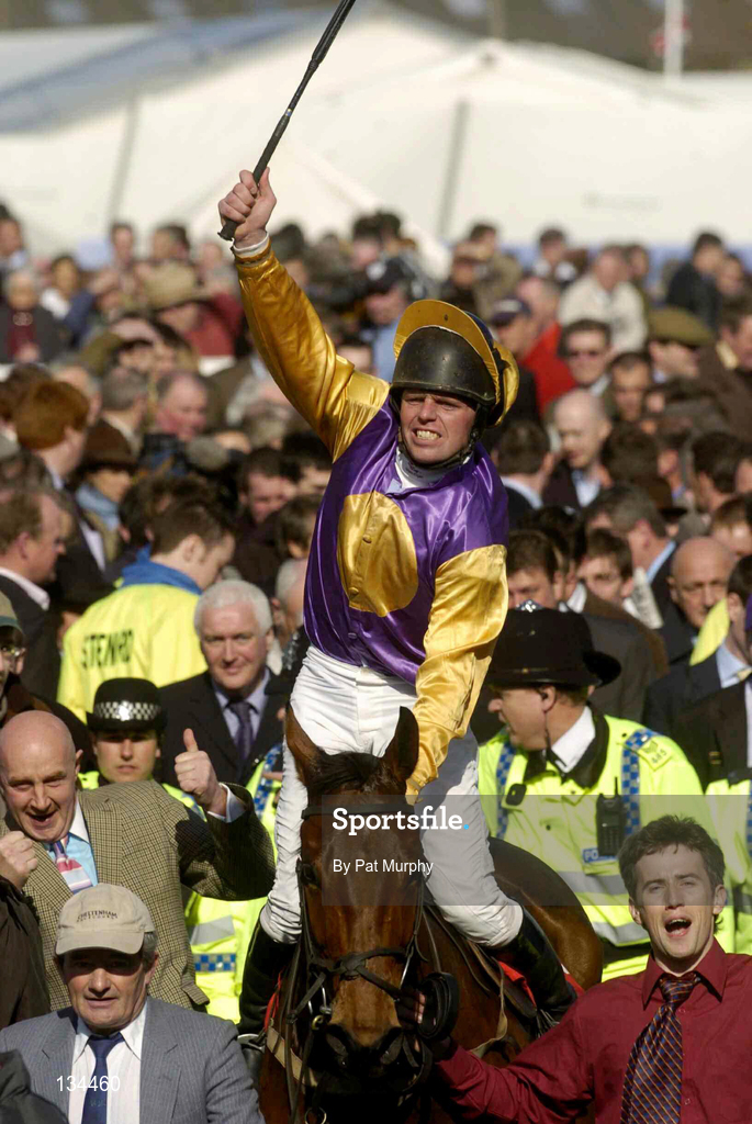 16 March 2004; Jockey Barry Cash celebrates as he arrives into the winners enclosure after winning The Lethbey & Christopher Supreme Novices' Hurdle on Brave Inca during Day One of the Cheltenham Racing Festival at Prestbury Park in Cheltenham, England. Photo by Pat Murphy/Sportsfile