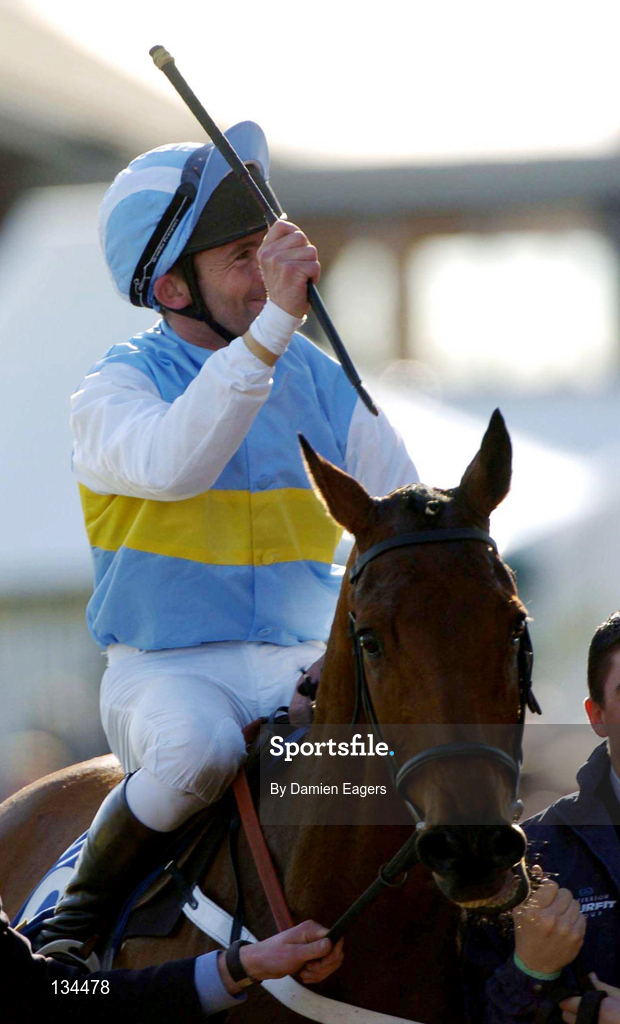 16 March 2004; Jockey Conor O'Dwyer celebrates after winning the Smurfit Champion Hurdle Challenge Trophy on Hardy Eustace during Day One of the Cheltenham Racing Festival at Prestbury Park in Cheltenham, England. Photo by Damien Eagers/Sportsfile
