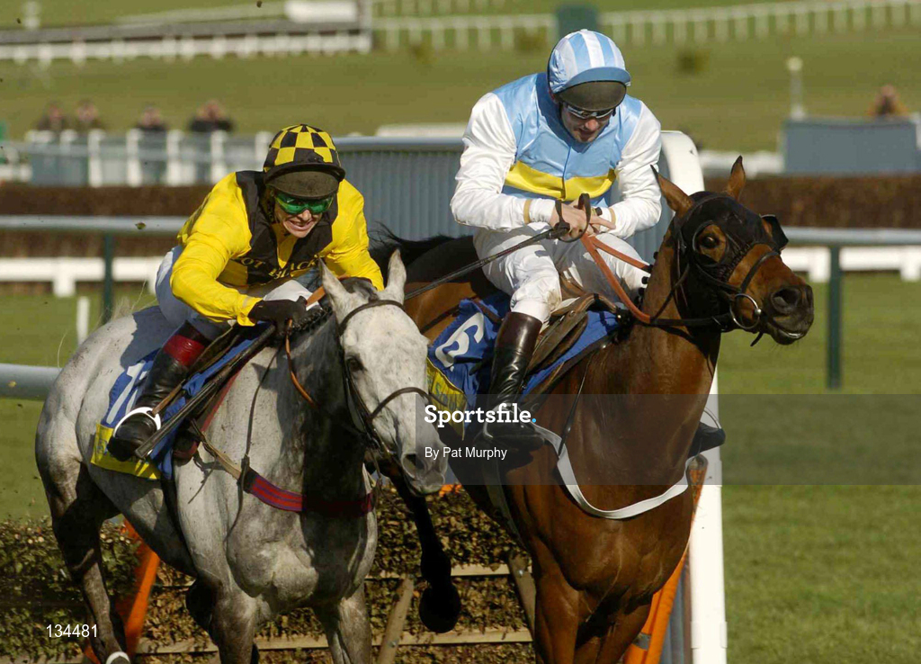 16 March 2004; Hardy Eustace, right, with Conor O'Dwyer up, jumps the last alongside eventual second place finisher Rooster Brooster, with Richard Johnson up, on their way to winning the Smurfit Champion Hurdle Challenge Trophy during Day One of the Cheltenham Racing Festival at Prestbury Park in Cheltenham, England. Photo by Pat Murphy/Sportsfile