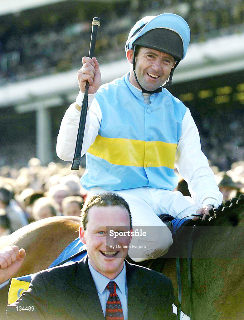16 March 2004; Jockey Conor O'Dwyer celebrates after winning the Smurfit Champion Hurdle Challenge Trophy on Hardy Eustace during Day One of the Cheltenham Racing Festival at Prestbury Park in Cheltenham, England. Photo by Damien Eagers/Sportsfile