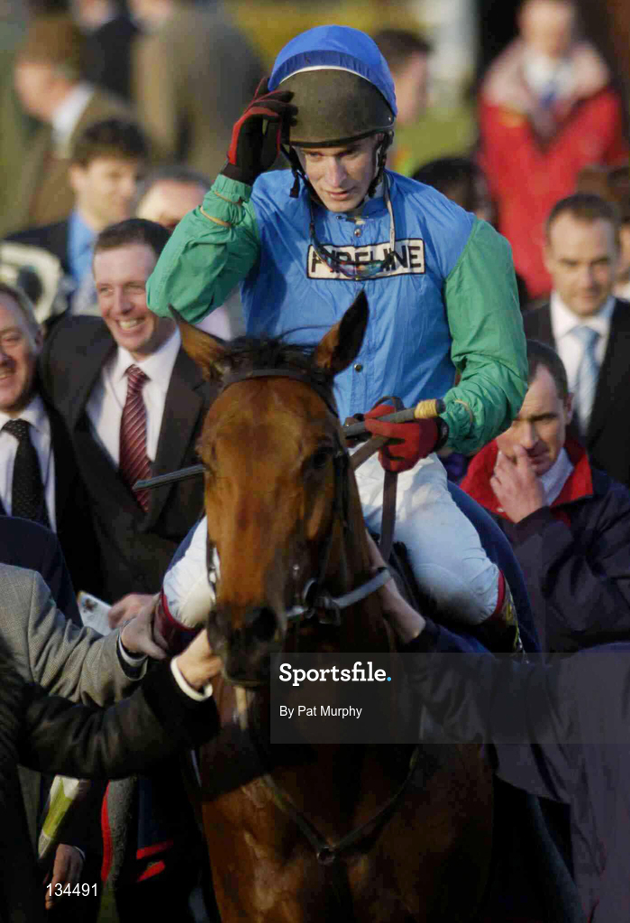 16 March 2004; Jockey Damien Edwards, on Maximize, salutes the crowd after winning the Fulke Walwyn Kim Muir Challenge Cup Handicap Chase during Day One of the Cheltenham Racing Festival at Prestbury Park in Cheltenham, England. Photo by Pat Murphy/Sportsfile