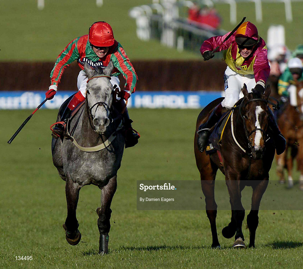 16 March 2004; Fork Lightning, left, with Robert Thornton up, races alongside eventual second place finisher Shardam, with Carl Llewellyn up, on their way to winning the William Hill NH Handicap Chase during Day One of the Cheltenham Racing Festival at Prestbury Park in Cheltenham, England. Photo by Damien Eagers/Sportsfile
