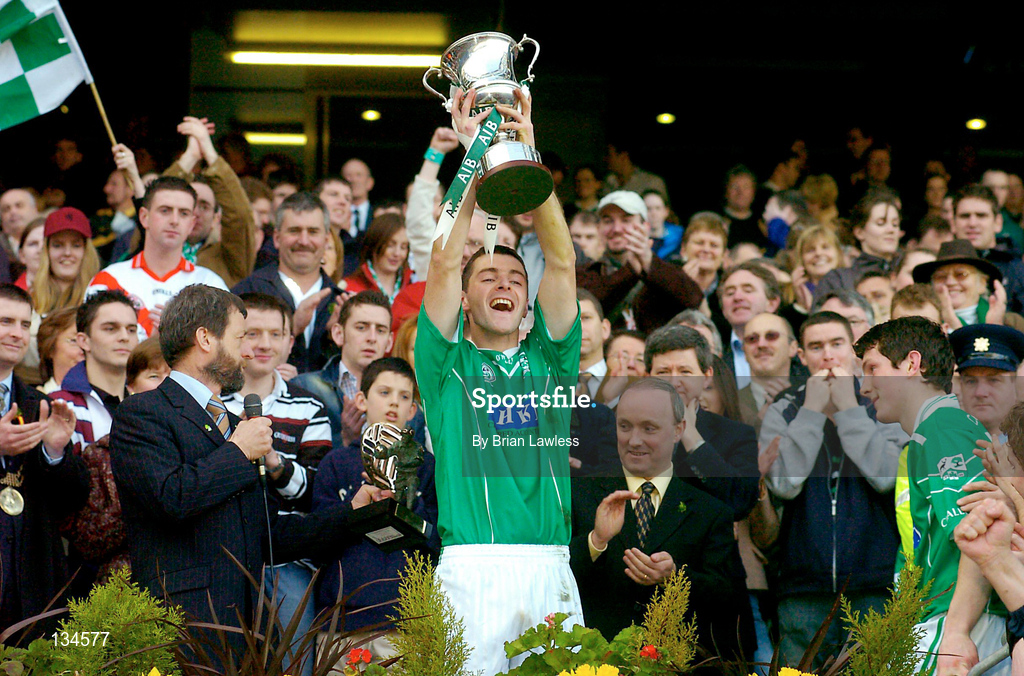 17 March 2004; Caltra captain Noel Meehan lifts the Tommy Moore cup in the company of GAA President Sean Kelly, left, and Donal Forde, Managing Director, AIB Bank, following the AIB All-Ireland Senior Club Football Championship Final between An Gaeltacht and Caltra at Croke Park in Dublin. Photo by Brian Lawless/Sportsfile