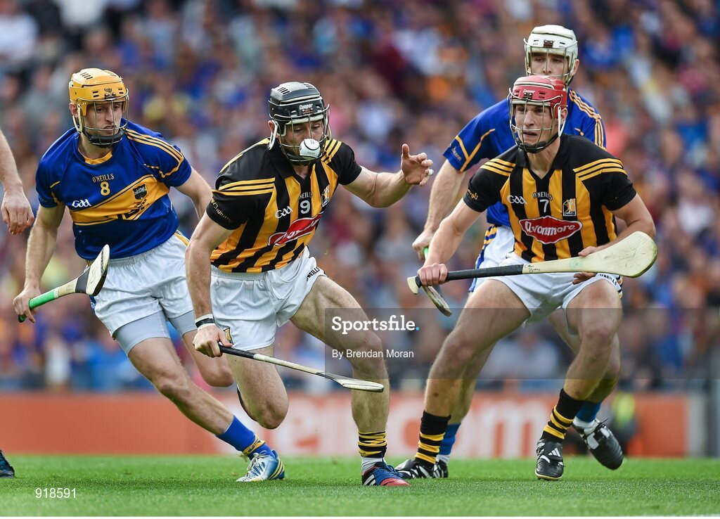 27 September 2014; Conor Fogarty, centre, Kilkenny, with support from team-mate Cillian Buckley in action against Shane McGrath, left, Tipperary. GAA Hurling All Ireland Senior Championship Final Replay, Kilkenny v Tipperary. Croke Park, Dublin. Picture credit: Brendan Moran / SPORTSFILE