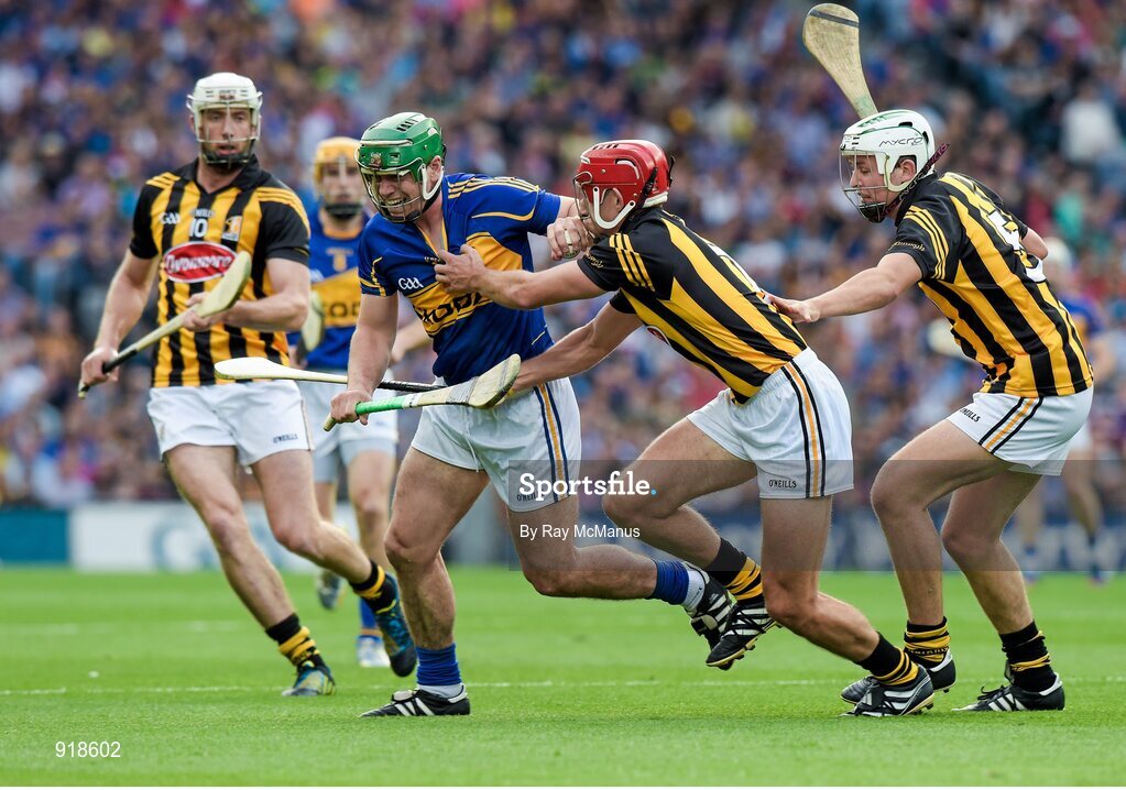 27 September 2014; John O'Dwyer, Tipperary, in action against, from right, Cillian Buckley, Colin Fennelly and Padraig Walsh, Kilkenny. GAA Hurling All Ireland Senior Championship Final Replay, Kilkenny v Tipperary. Croke Park, Dublin. Picture credit: Ray McManus / SPORTSFILE