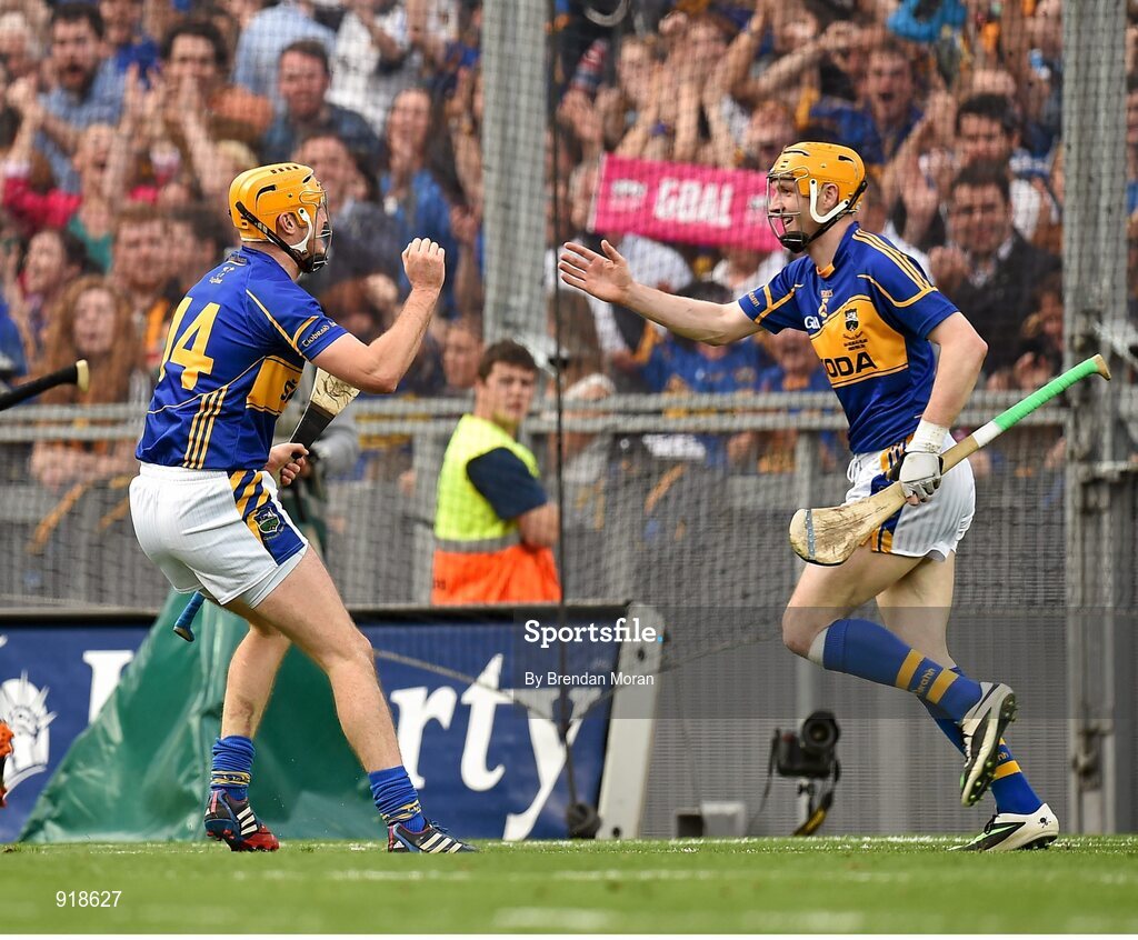 27 September 2014; Tipperary's Seamus Callanan, left, celebrates with team-mate Lar Corbett after scoring his side's first goal. GAA Hurling All Ireland Senior Championship Final Replay, Kilkenny v Tipperary. Croke Park, Dublin. Picture credit: Brendan Moran / SPORTSFILE
