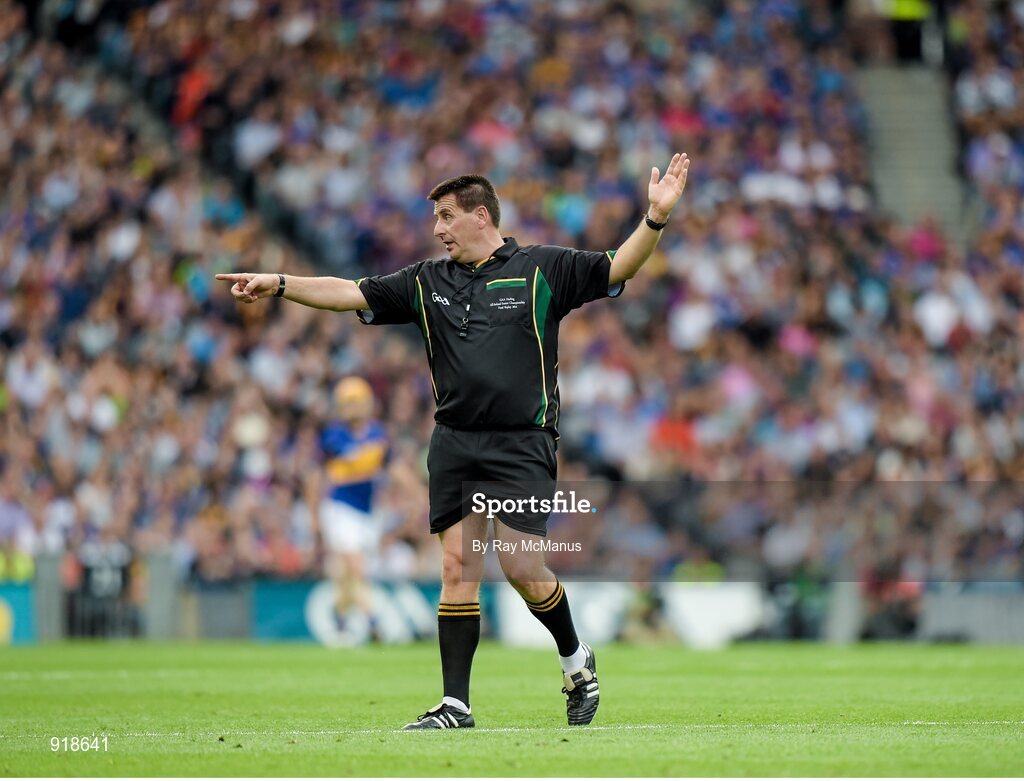 27 September 2014; Referee Brian Gavin indicates a free for Tipperary. GAA Hurling All Ireland Senior Championship Final Replay, Kilkenny v Tipperary. Croke Park, Dublin. Picture credit: Ray McManus / SPORTSFILE