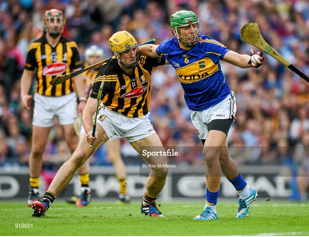 27 September 2014; James Barry, Tipperary, clears under pressure from Colin Fennelly, Kilkenny. GAA Hurling All Ireland Senior Championship Final Replay, Kilkenny v Tipperary. Croke Park, Dublin. Picture credit: Ray McManus / SPORTSFILE