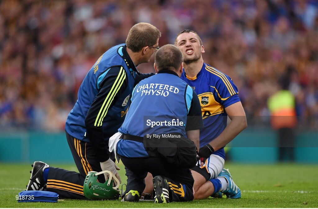 27 September 2014; James Barry, Tipperary, is attended to after sustaining a second half injury. GAA Hurling All Ireland Senior Championship Final Replay, Kilkenny v Tipperary. Croke Park, Dublin. Picture credit: Ray McManus / SPORTSFILE