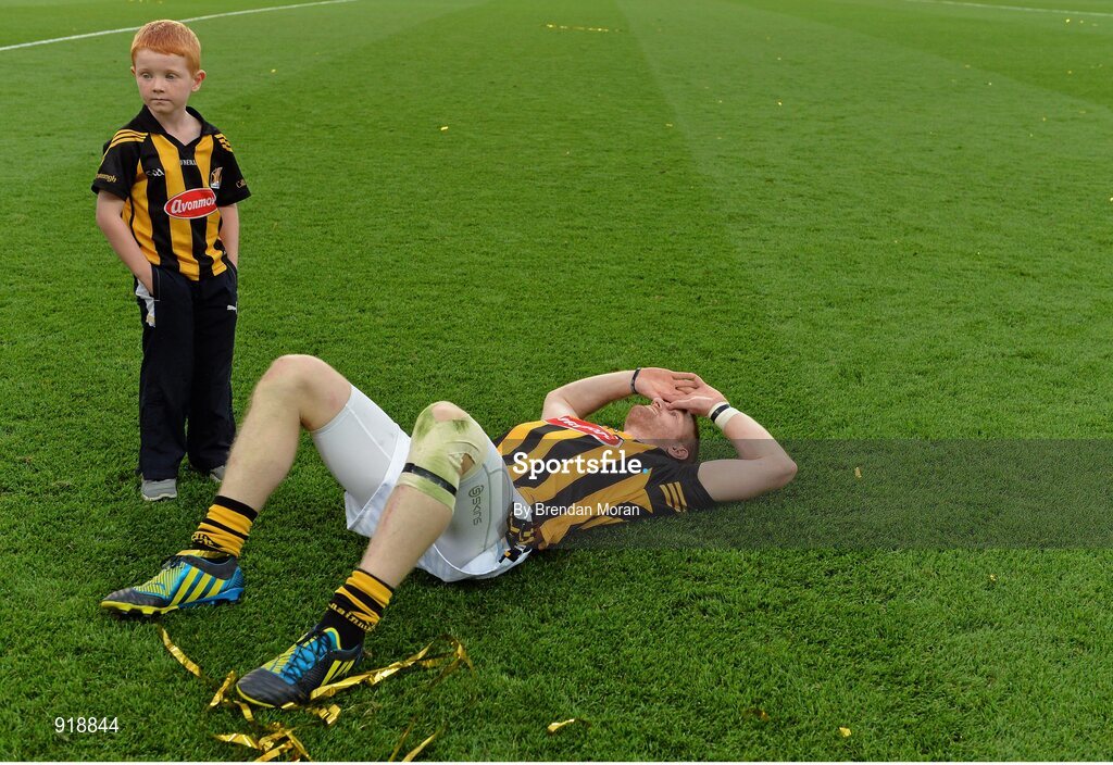 27 September 2014; Kilkenny's Richie Power lies exhausted on the pitch as his son Rory looks on after the game. GAA Hurling All Ireland Senior Championship Final Replay, Kilkenny v Tipperary. Croke Park, Dublin. Picture credit: Brendan Moran / SPORTSFILE