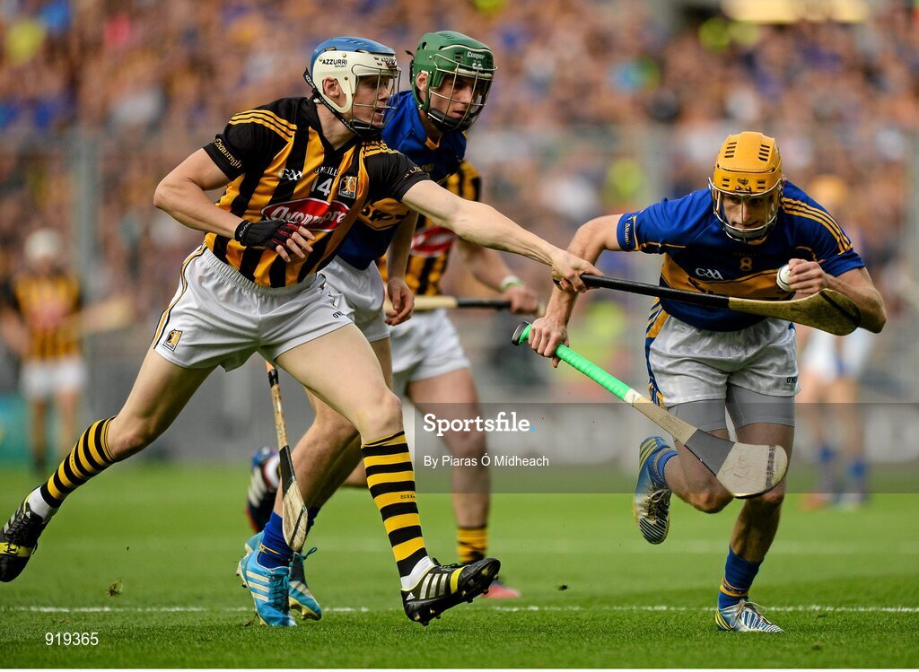 27 September 2014; Shane McGrath, Tipperary, supported by team-mate Cathal Barrett, in action against TJ Reid, Kilkenny. GAA Hurling All Ireland Senior Championship Final Replay, Kilkenny v Tipperary. Croke Park, Dublin. Picture credit: Piaras Ó Mídheach / SPORTSFILE