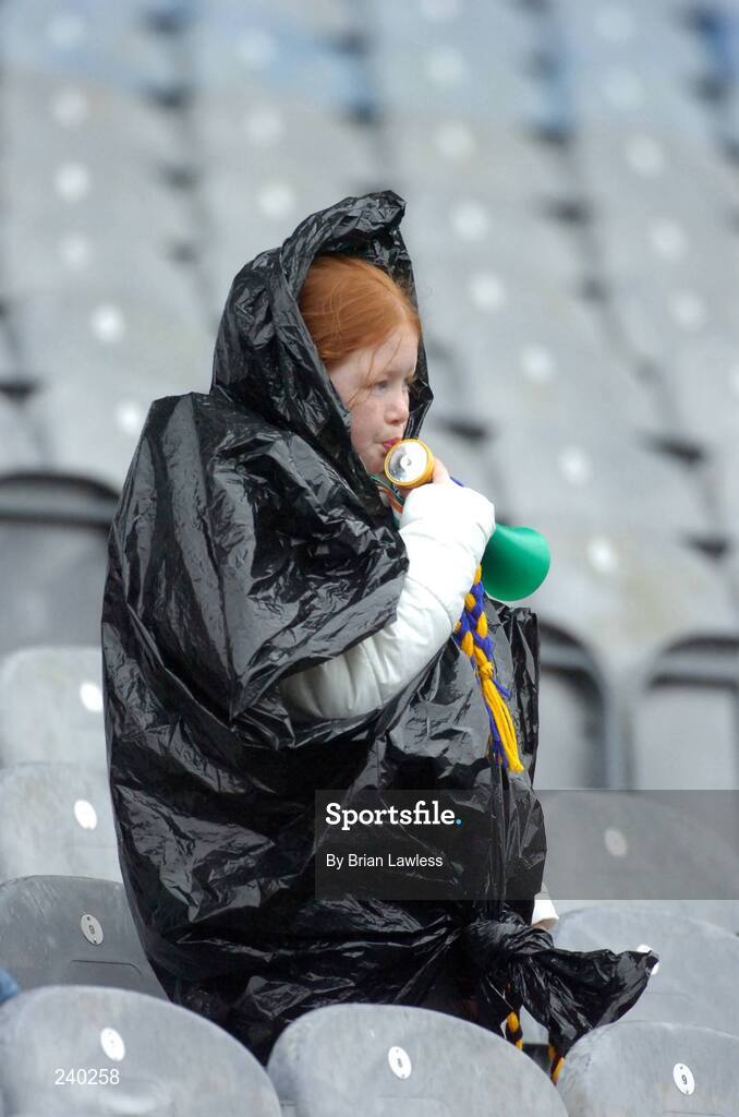 17 March 2007; A hurling fan watches the match during a rain shower. AIB All-Ireland Senior Club Hurling Championship Final, Ballyhale Shamrocks v Loughrea, Croke Park, Dublin. Picture credit: Brian Lawless / SPORTSFILE