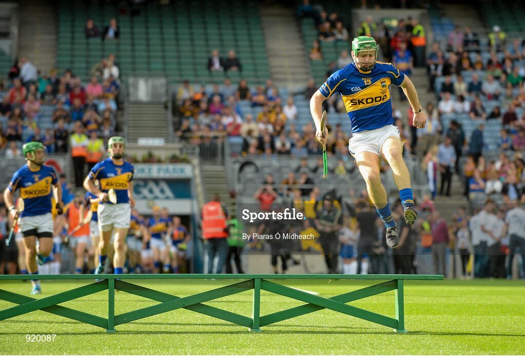 27 September 2014; Tipperary's Noel McGrath jumps over the bench before the pre-match team photograph. GAA Hurling All Ireland Senior Championship Final Replay, Kilkenny v Tipperary. Croke Park, Dublin. Picture credit: Piaras Ó Mídheach / SPORTSFILE