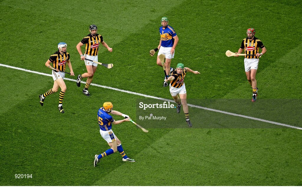 27 September 2014; Lar Corbett, Tipperary, in action against, from left, TJ Reid, Jackie Tyrrell, Paul Murphy, and Eoin Larkin, Kilkenny. GAA Hurling All Ireland Senior Championship Final Replay, Kilkenny v Tipperary. Croke Park, Dublin. Picture credit: Pat Murphy / SPORTSFILE