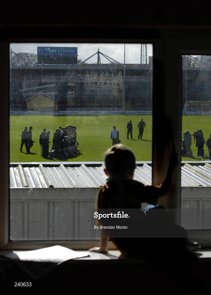 19 March 2007; Young Kilkenny fan Jack Sheridan, age 5, second cousin of Kilkenny hurler Tommy Walsh, watches as the Kilkenny hurling squad have their team photograph taken before the game. Allianz National Hurling League, Kilkenny v Limerick, Division 1B, Round 3, Nowlan Park, Kilkenny. Picture credit: Brendan Moran / SPORTSFILE