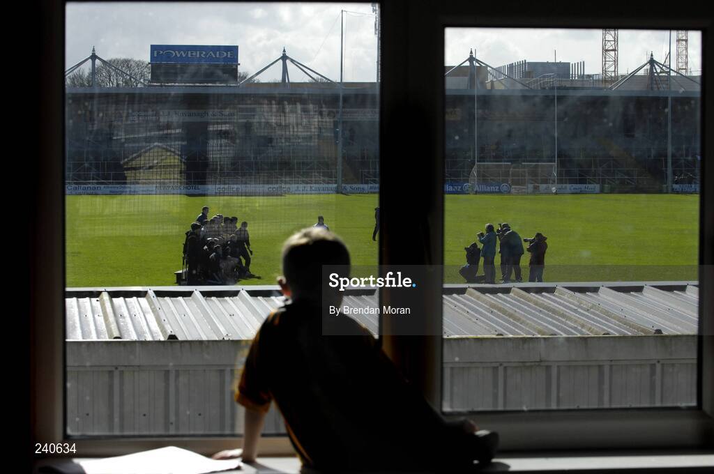 19 March 2007; Young Kilkenny fan Jack Sheridan, age 5, second cousin of Kilkenny hurler Tommy Walsh, watches as the Kilkenny hurling squad have their team photograph taken before the game. Allianz National Hurling League, Kilkenny v Limerick, Division 1B, Round 3, Nowlan Park, Kilkenny. Picture credit: Brendan Moran / SPORTSFILE