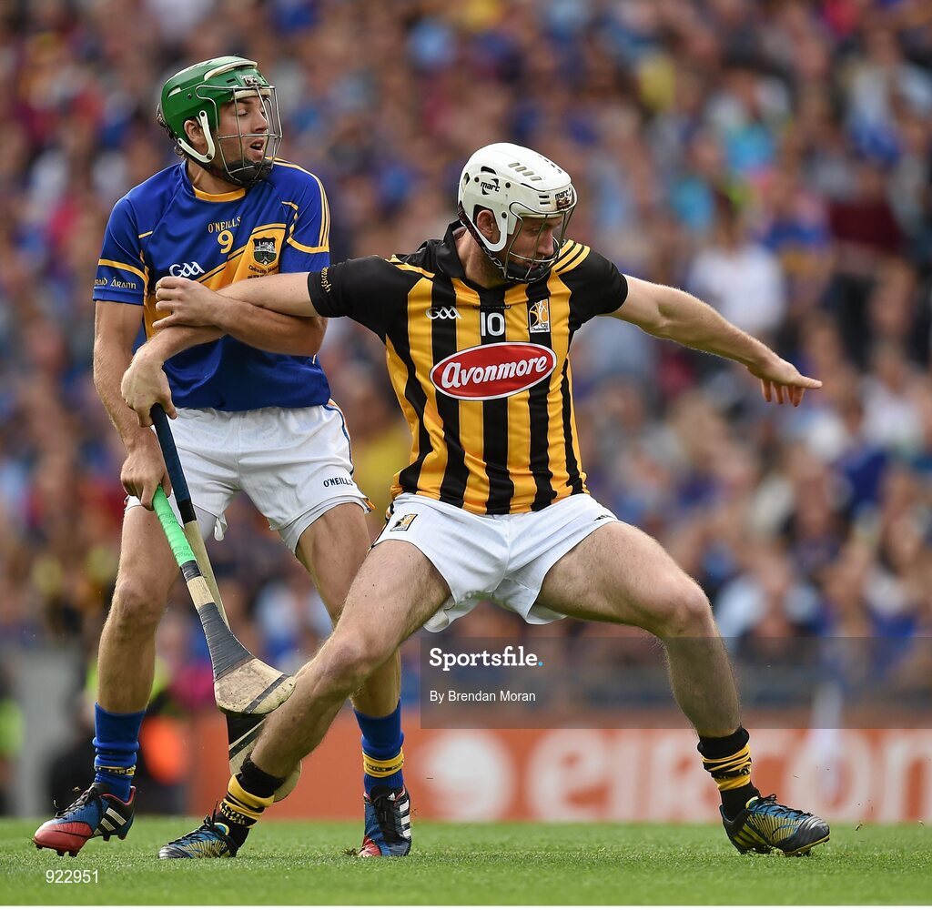 27 September 2014; Michael Fennelly, Kilkenny, is held by James Woodlock, Tipperary, as they contest possession. GAA Hurling All Ireland Senior Championship Final Replay, Kilkenny v Tipperary. Croke Park, Dublin. Picture credit: Brendan Moran / SPORTSFILE