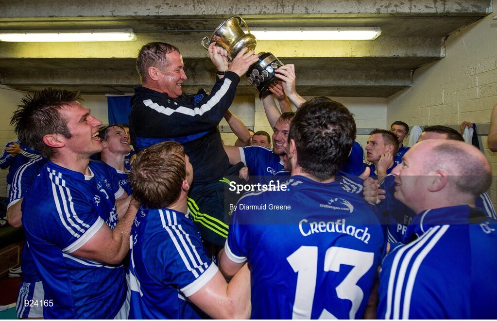 12 October 2014; Cratloe manager Colm Collins is held aloft in the dressing room by his players after victory over Eire Og. Clare County Senior Football Championship Final, Cratloe v Eire Og. Cusack Park, Ennis, Co. Clare. Picture credit: Diarmuid Greene / SPORTSFILE